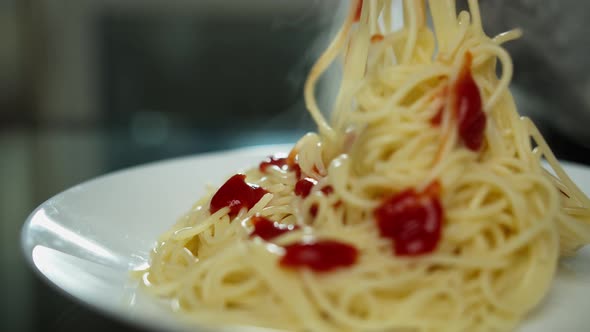 Woman Eating Pasta with Ketchup Plate with Hot Pasta Closeup Italian Food