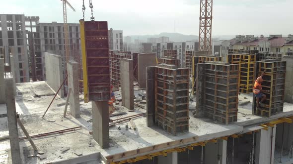 Workers Working on the Construction Site Removed From the Drone alt