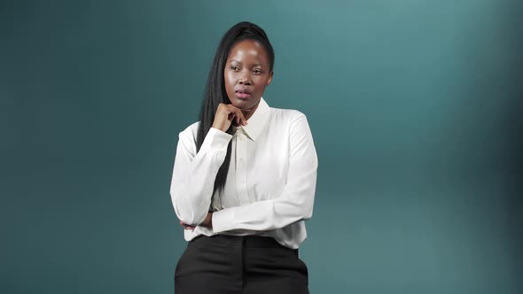 A Young Charming Woman Crosses Her Arms Over Chest Trying to Be Serious Thinks About Her Business alt