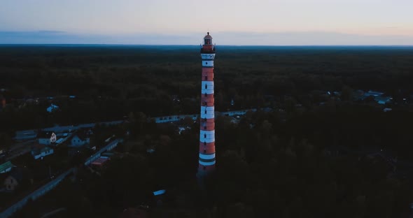 Old Active Lighthouse. Gloomy Sky and Cold Blue Atmosphere. Beach, North Misty Sea in Vintage alt