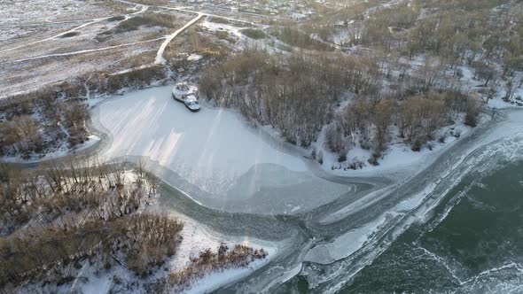 Flying Above Coast of Frozen River