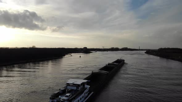 Barge Ship With Cars Sailing Across Oude Maas River Near Zwijndrecht, Netherlands. - aerial alt
