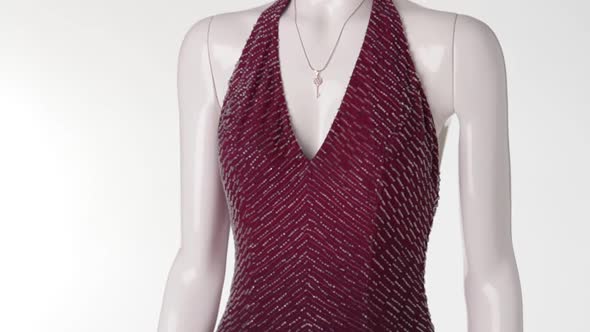 Female Mannequin Wearing Vinous Dress. alt