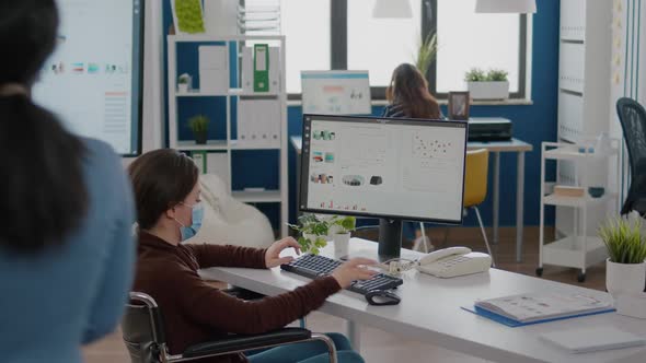 Paralysed Financial Expert Wearing Face Mask Analysing Economy Statistics alt