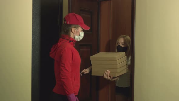 Courier delivers pizza home. Coronovirus pandemic