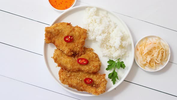 Crispy Chicken Fried in Breadcrumbs Served with Rice