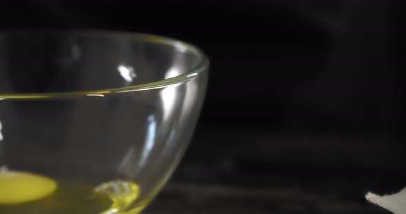 Beautiful well-groomed female hands with manicure take a white chicken egg alt