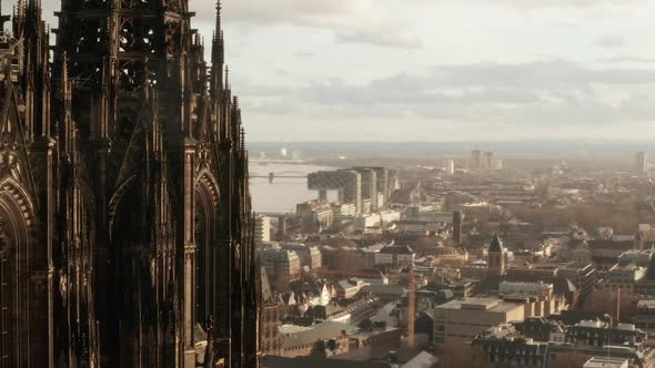 AERIAL: Close Up Circling Around Cologne Cathedral in Beautiful Sunlight  alt