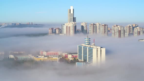 8K Fog Between Skyscraper Residences in Modern Urban City