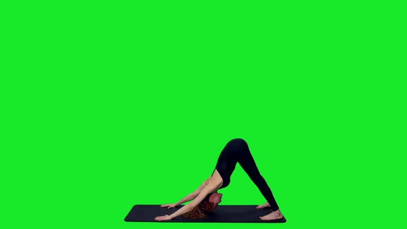 Sporty Fit Female Doing Yoga Against Green Screen