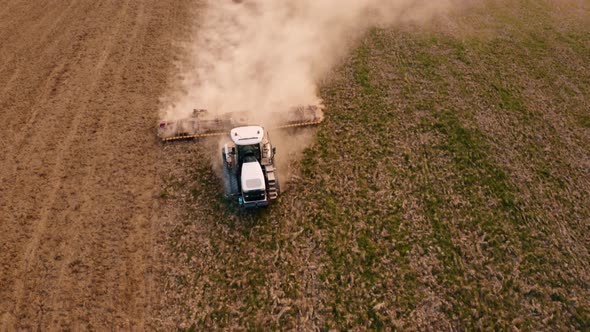 Above view of a field flying on a drone during sowing in the spring