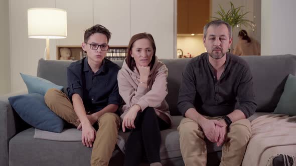 The Laptop Monitor Reflected on the Glasses of a Young Man alt