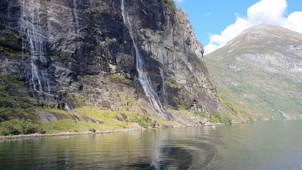 Seven sisters waterfall in the Geiranger fjord and the water surface alt
