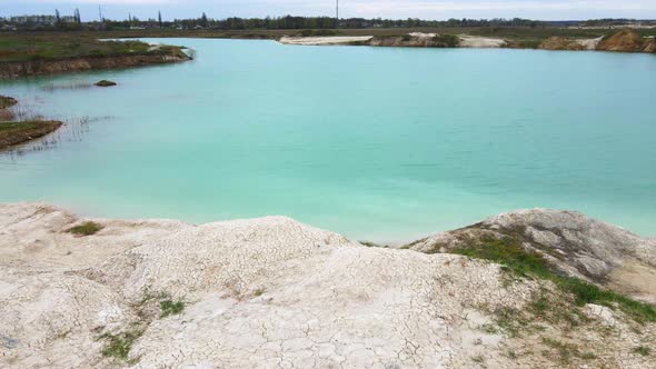 Aerial drone view Amazing industrial landscape, on Emerald lake in a flooded quarry alt