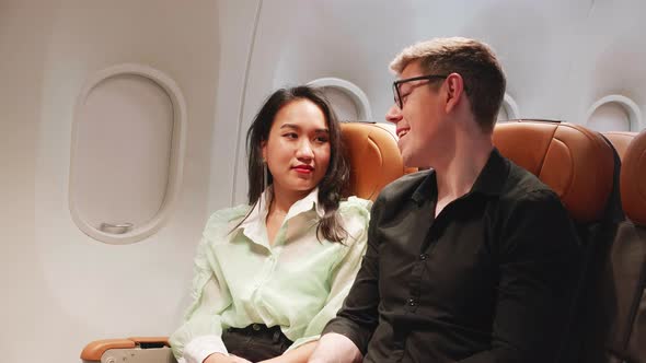 young couple in love traveling in airplane, Feeling excited and happy for honeymoon trip