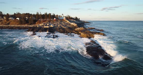 Aerial view of the Curtis island lighthouse Camden Maine USA while the waves hits the rocks alt