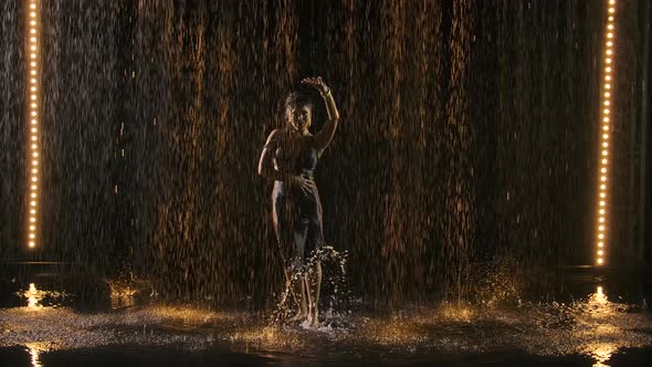 Silhouette of an Attractive Woman in a Wet Tight Dress Enjoying a Flamenco Dance in the Rain. Black alt