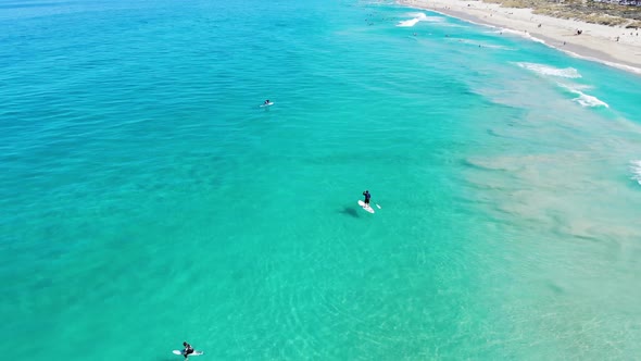 Aerial view of a Surfers at a Beach in Australia alt