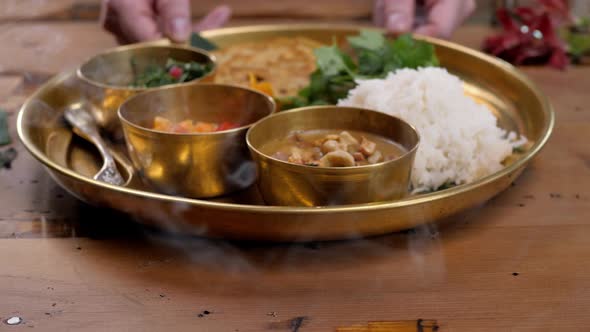 Spicy Chicken Tikka Masala in Bowl on Rustic Wooden Background alt