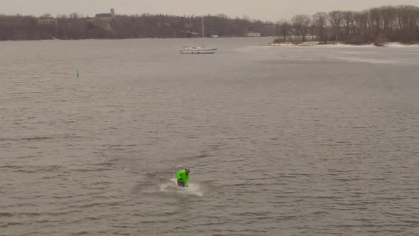 Young Man riding a Hydrofoil board alt