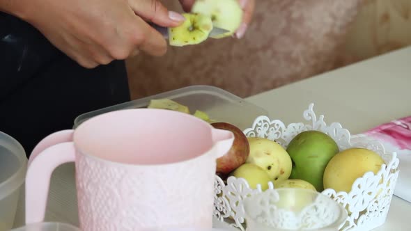 A Woman Cuts Apples. Ingredients For Making Apple Pie. Cooking Charlotte At Home