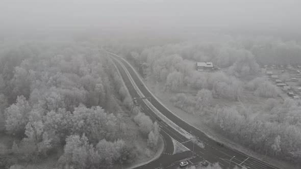 Road Intersection Winter Time Forest with Fog Aerial Establishing