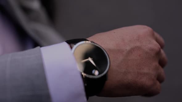 wristwatch of a man in a suit close-up