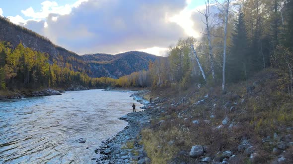Two Men Fishing on the Banks of a Picturesque River Panorama of the Water