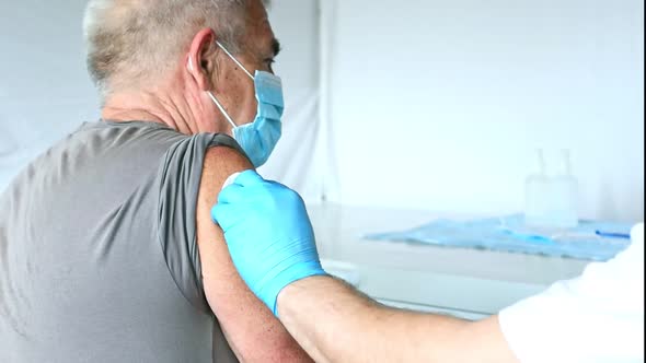 Elderly Man Getting Covid Vaccine alt