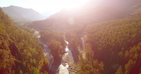 Fresh Mountain River and Meadow at Sunny Summer Morning. Rural Dirt Road Below alt