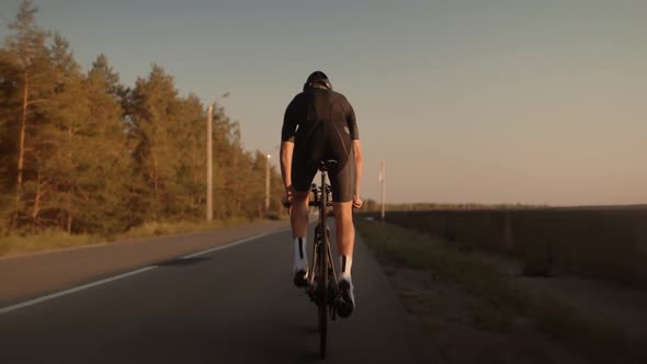 Triathlete Cyclist Training On Bicycle. Sport Recreation Workout. Fit Athlete Sport Workout Training alt