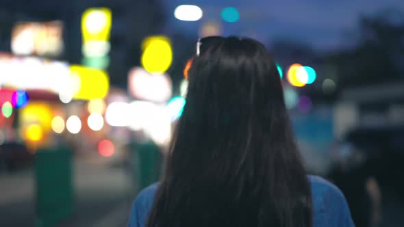 Young Woman Walking in the Night City alt