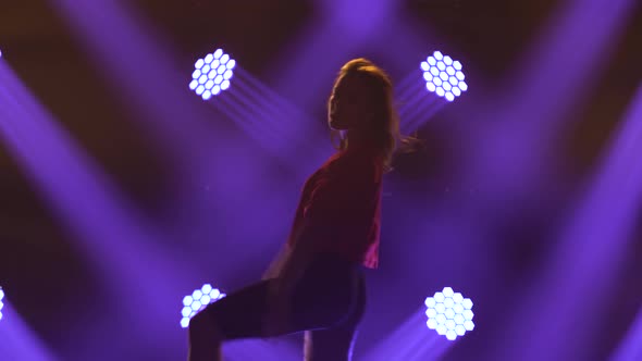 Modern Funk Jazz Movements Performed By a Young Girl Dancer. Silhouette of a Slender Girl alt