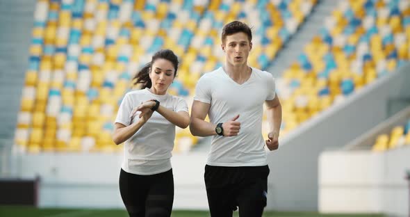 Couple of Joggers on Stadium