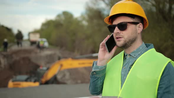 Portrait of an Engineer Talking on the Phone alt