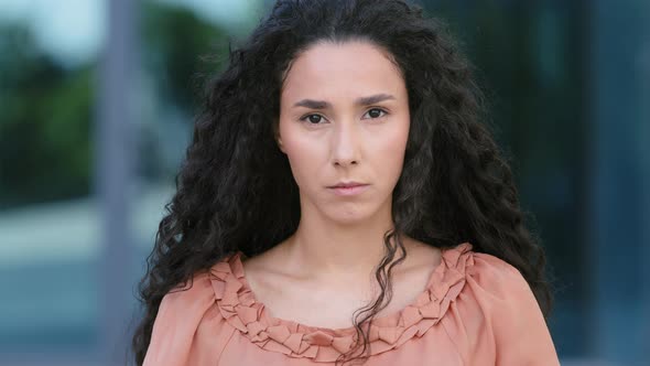 Close Up Upset Female Face of Sad Stressed Hispanic Girl Ethnic Woman Standing Outdoors Looking at alt