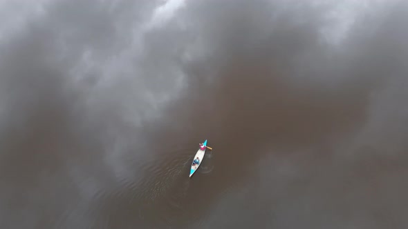Canoeing in Bad Weather Reflection Of Dark Clouds On Water Aerial Top