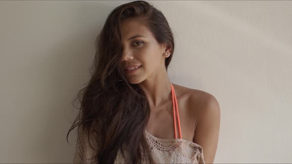 Long Haired Brunette Standing on White Background alt