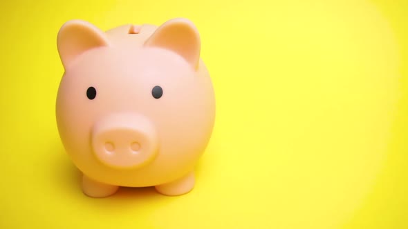 Piggy Moneybox at Yellow Background