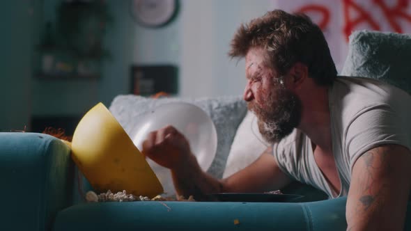 Drunk Man Waking Up with Face on Plate alt