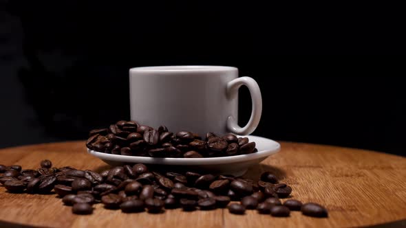 White mug with coffee on a saucer on a wooden background alt
