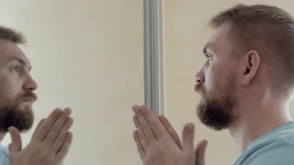 Bearded Man Using Facial Makeup