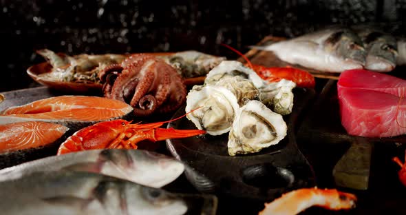 Different Types of Seafood Rotate on the Cutting Board.