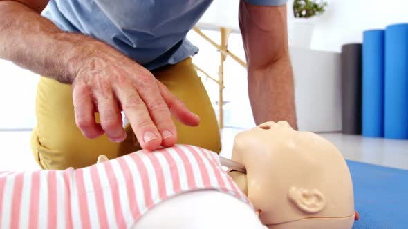 Male paramedic during cardiopulmonary resuscitation training alt