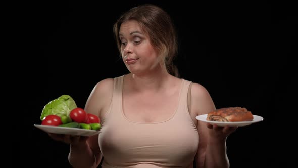 Portrait of Overweight Woman Choosing Unhealthy Sweet Dessert Vs Healthful Vegetables at Black alt
