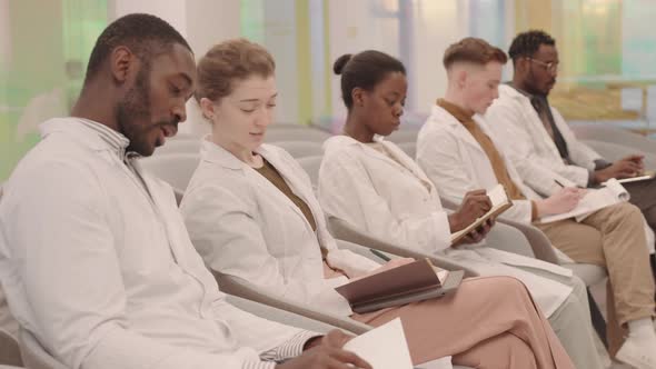 Diverse Group of Medical Students Chatting at Class alt