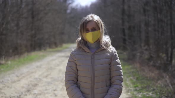 Woman in Yellow Protective Mask. Quarantine