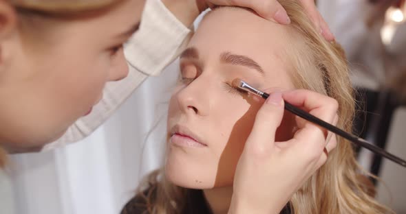 Make Up Artist Applies Eye Shadow With A Brush