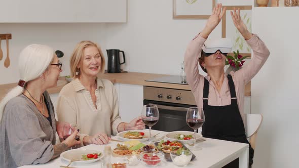 Adult Woman in VR Headset at Dinner with Friends alt