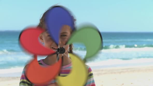 MCU OF A GIRL SPINNING A PIN WHEEL alt